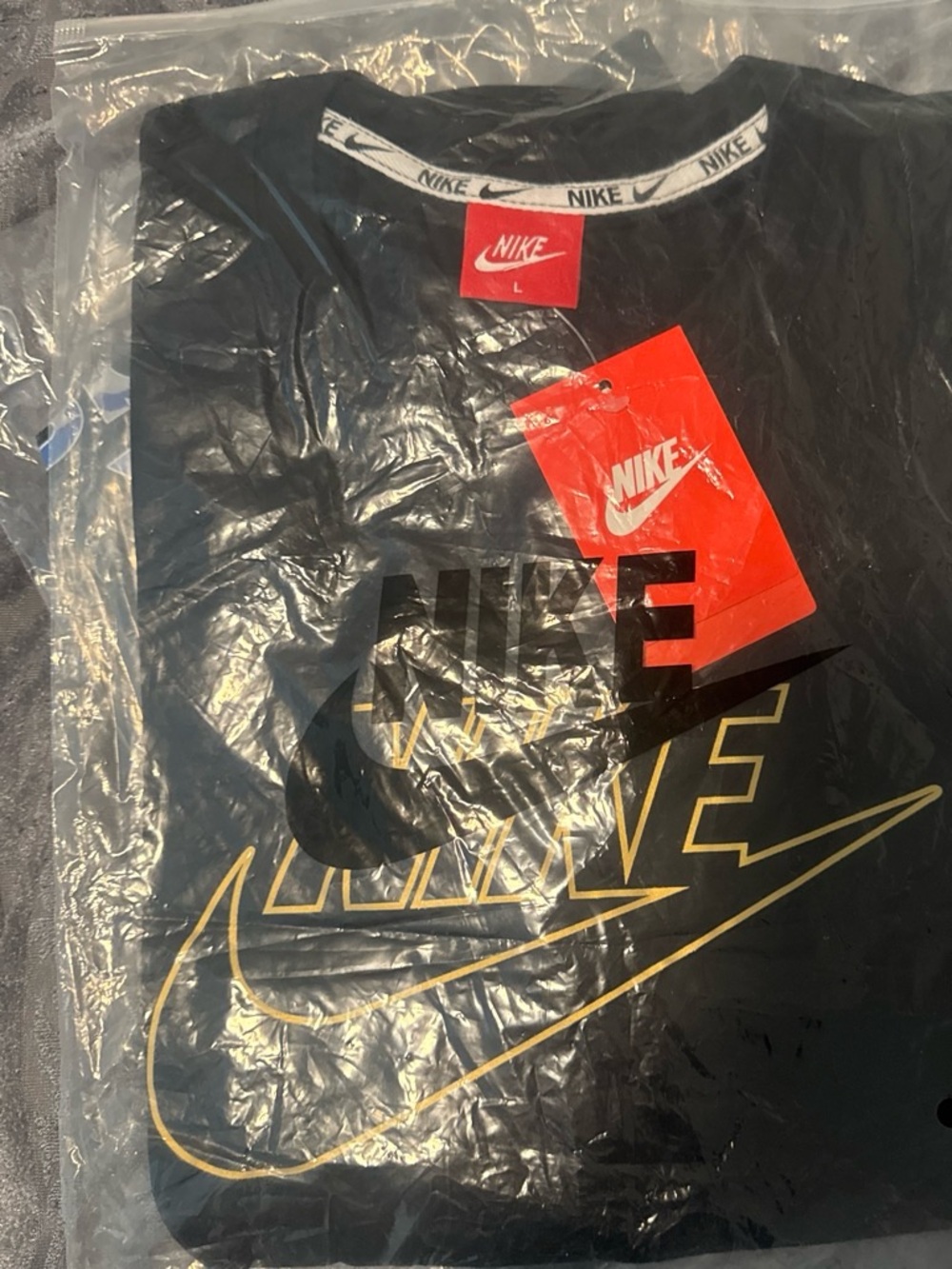 Nike Men’s Black Short-Sleeve Tee with Gold Logo Accents